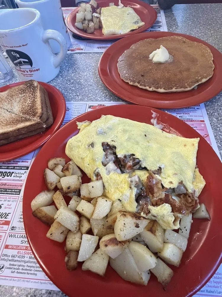 A Bacon and Cheese Omelette and Home Fries